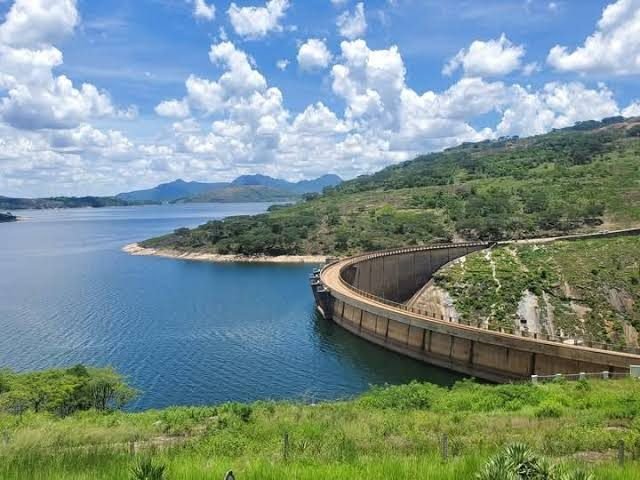 The curved Mutirikwi dam wall and the lake beyond