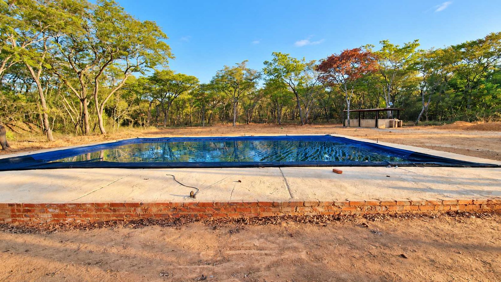 The swimming pool in its brick surround
