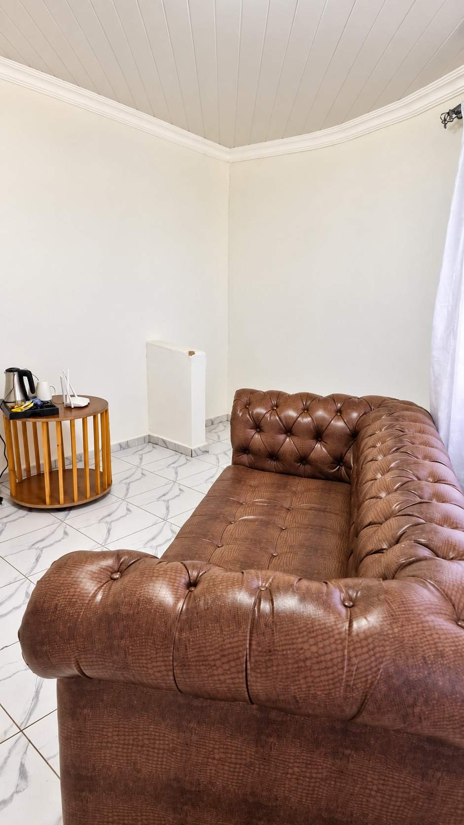 Executive Chalet sitting area with a brown leather sofa