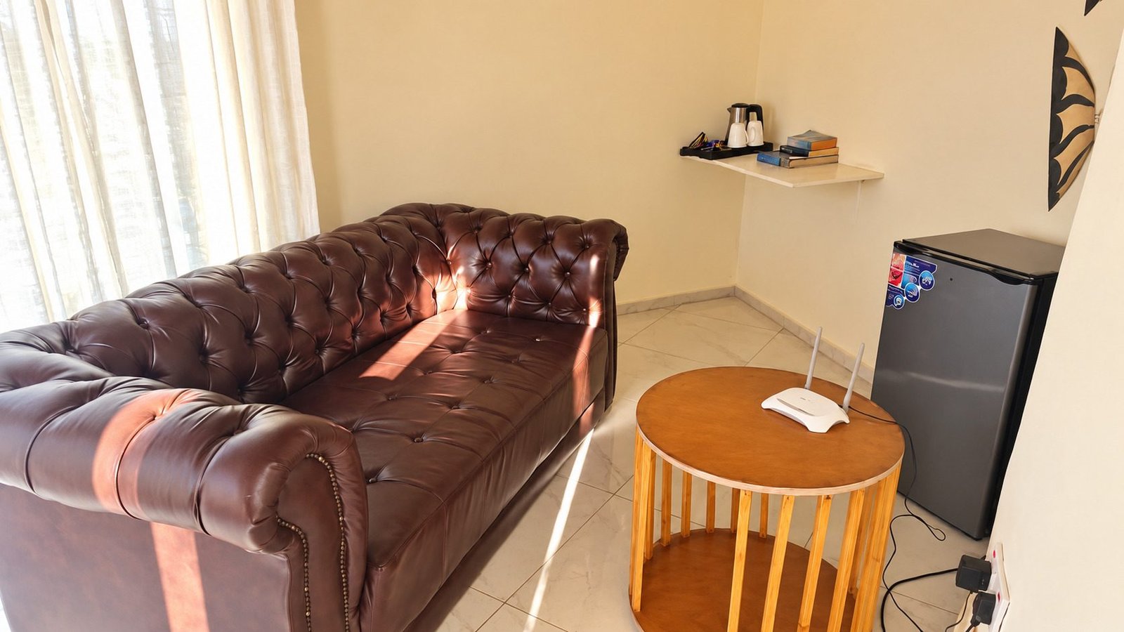 Standard Chalet lounge with a leather sofa, fridge and side table